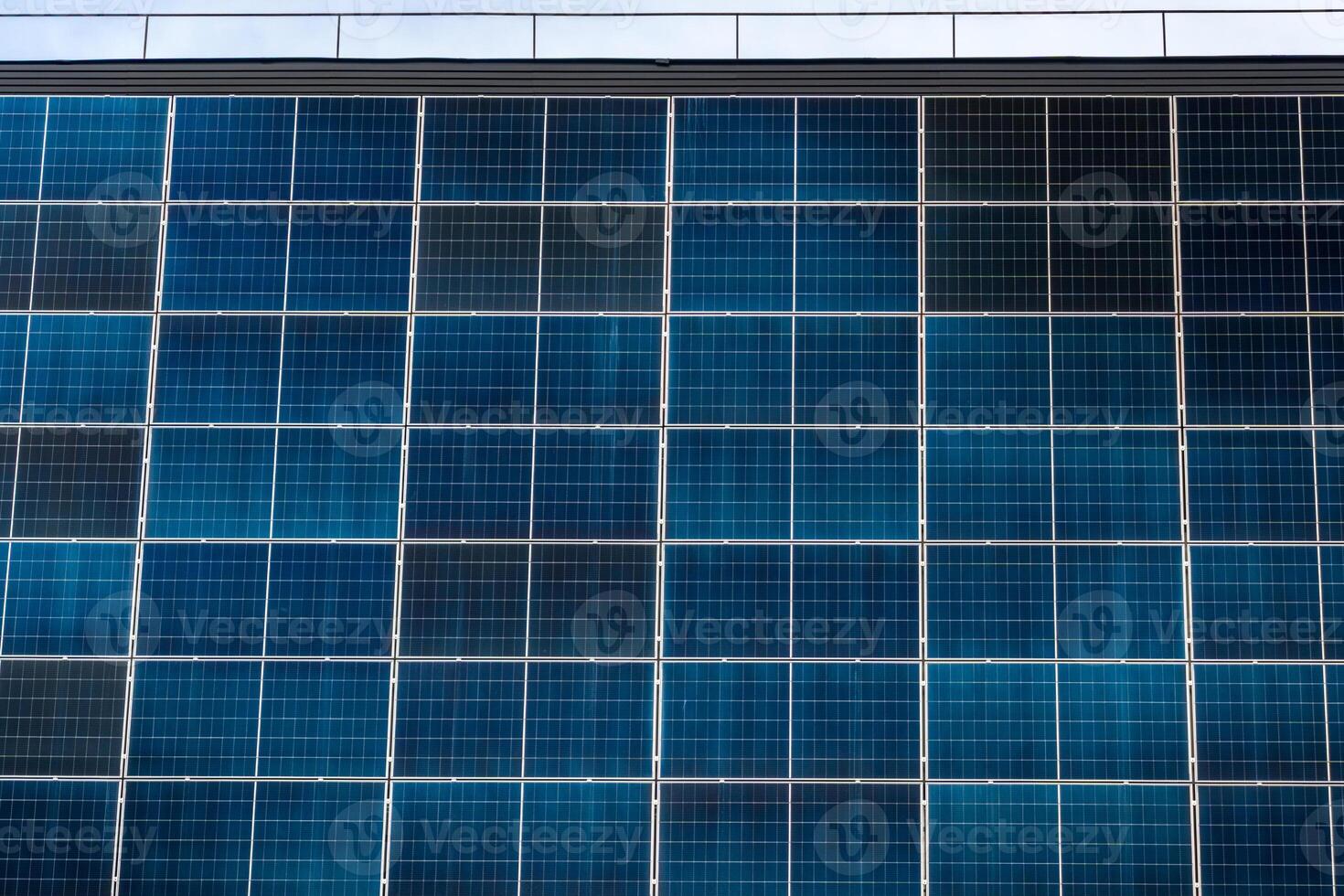 Solar Panels on Building Facade Showing Clean Energy Grid Pattern photo