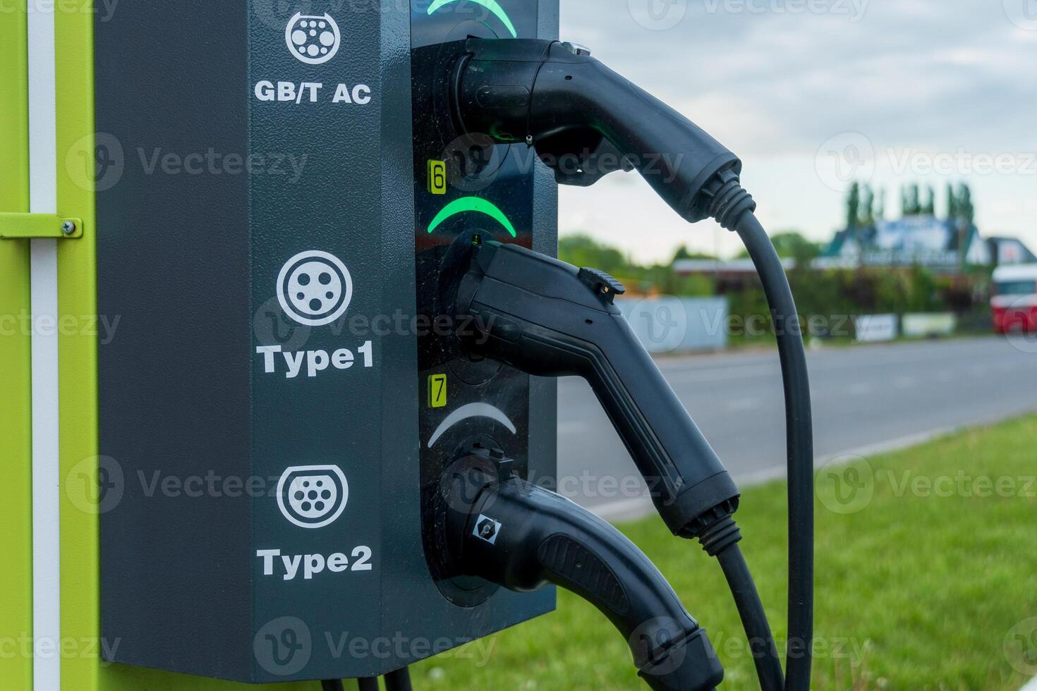 Electric Vehicle Charger with Three Connector Types Ready for Charging photo