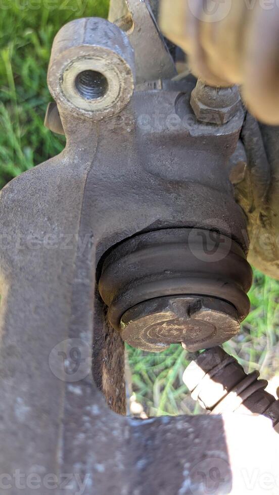 A closeup view of a brake caliper, essential for vehicle maintenance and repair tasks photo