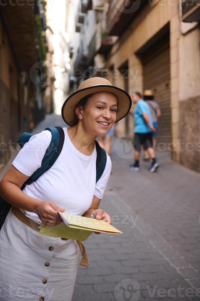 Tourist Woman Exploring Old City Streets with Map photo