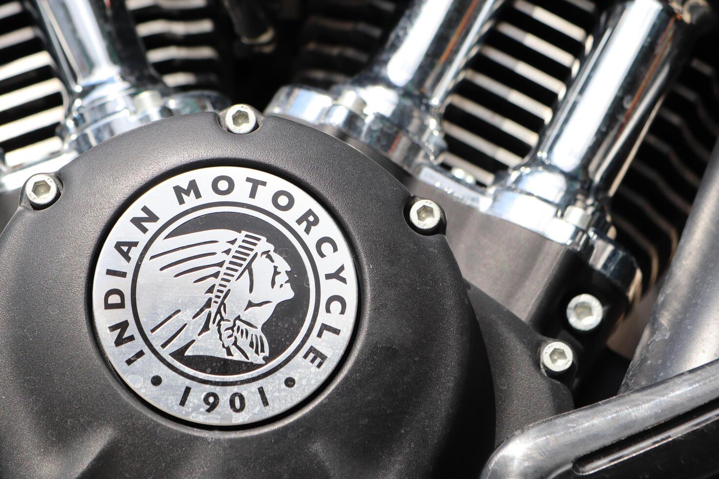 09.3.2025 Moldova A CloseUp View of the Iconic Indian Motorcycle Engine Emblem and Its Shiny Chrome Components photo