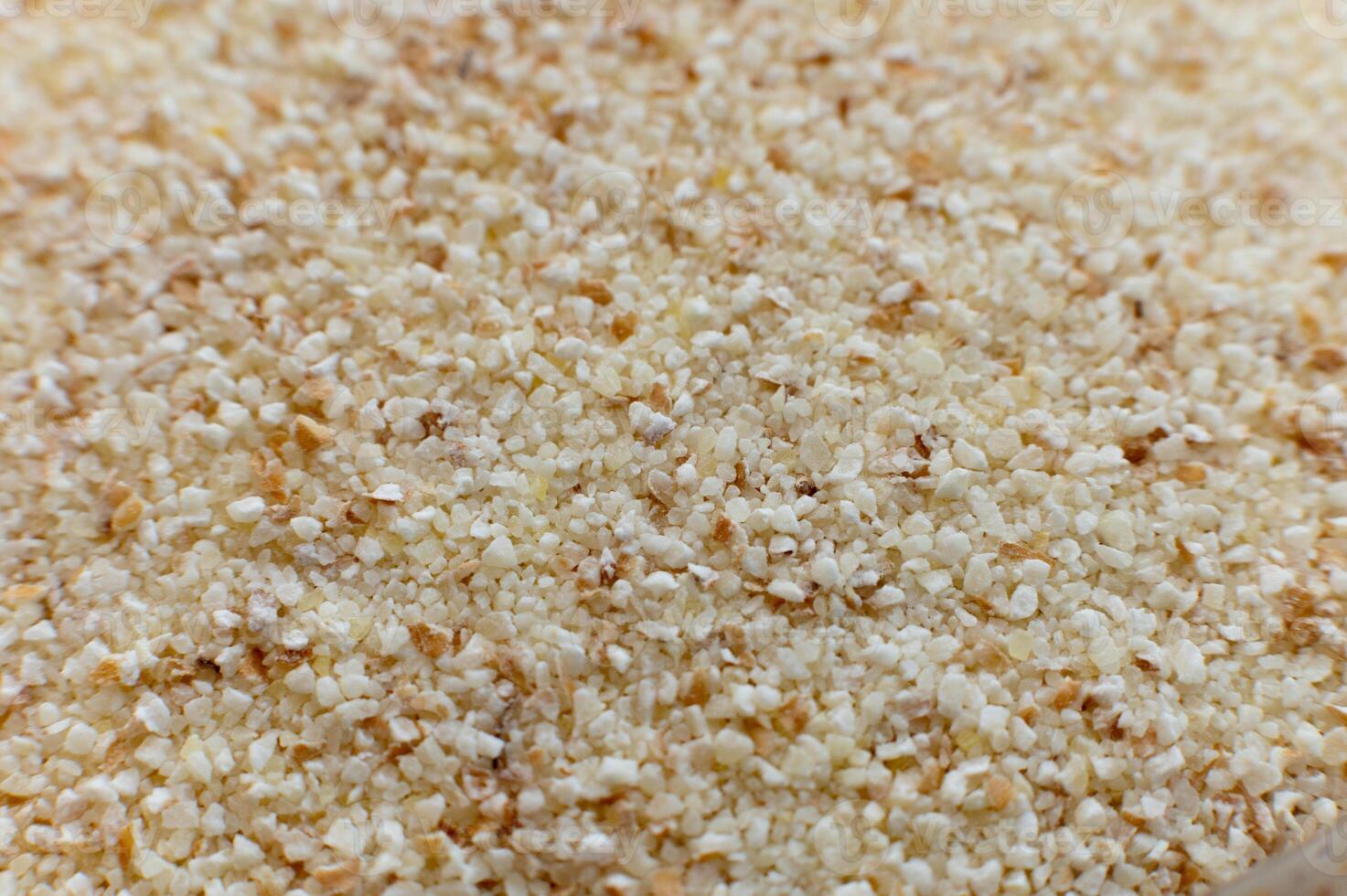select corn bran, still as good and as select as it is now. macro shot of finely ground cereal, spherhu view. cereal background photo