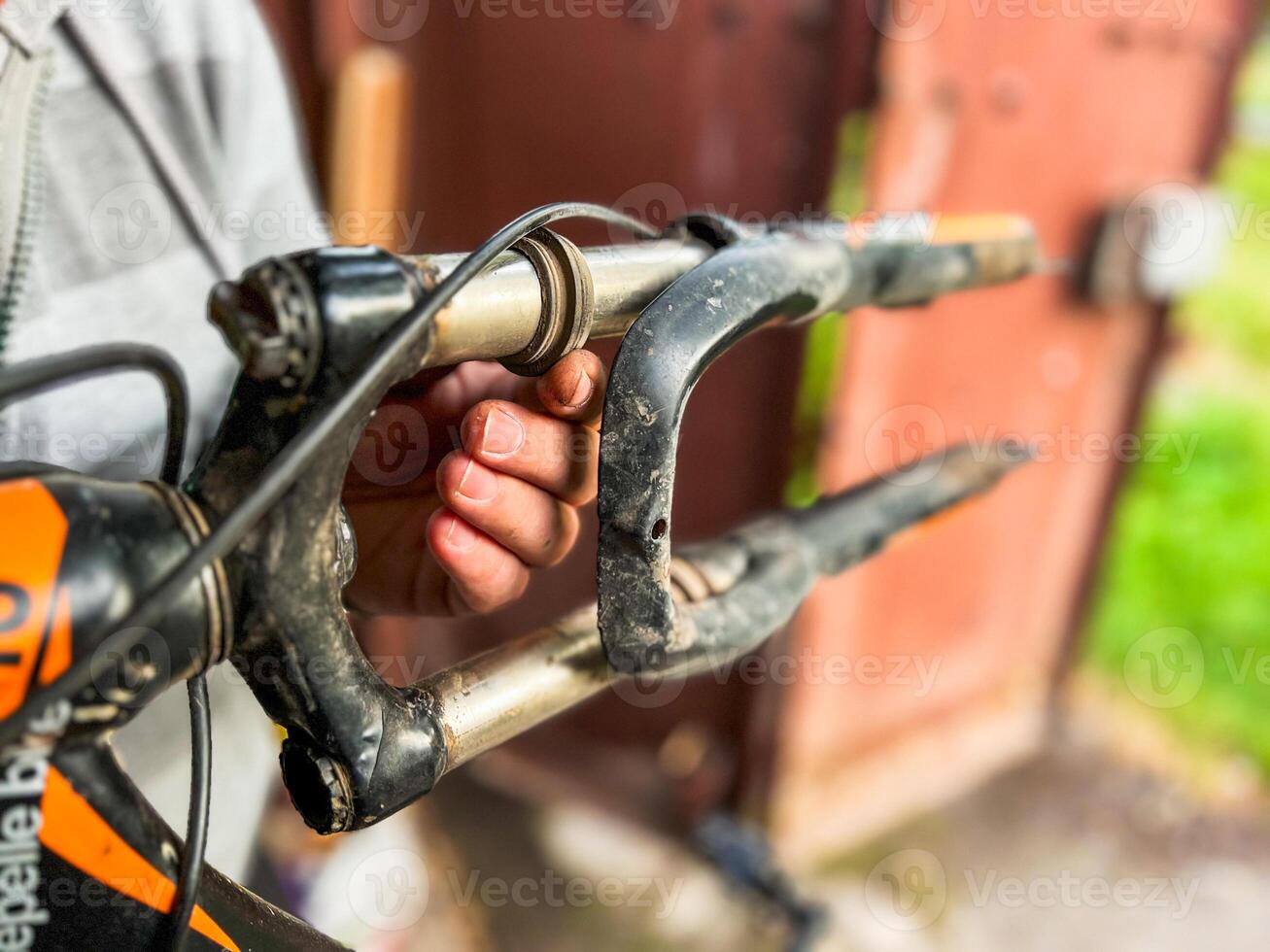 Mechanic repairing mountain bike stem and fork close-up view photo