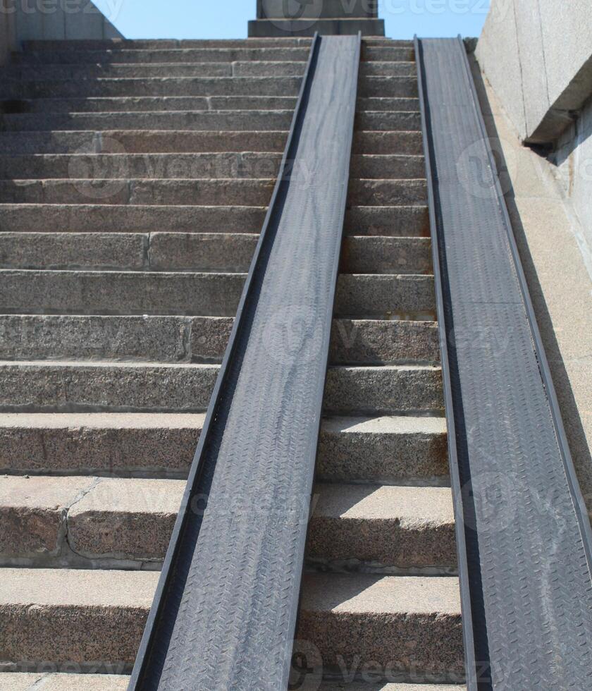 Ramp for people with disabilities and for those who has reduced mobility or for people with wheelchairs or bicycles photo
