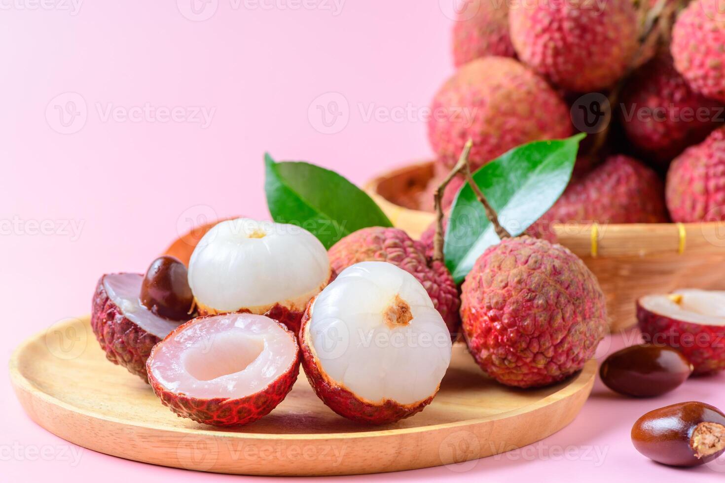 Juicy Lychee with cut in half and leaves photo