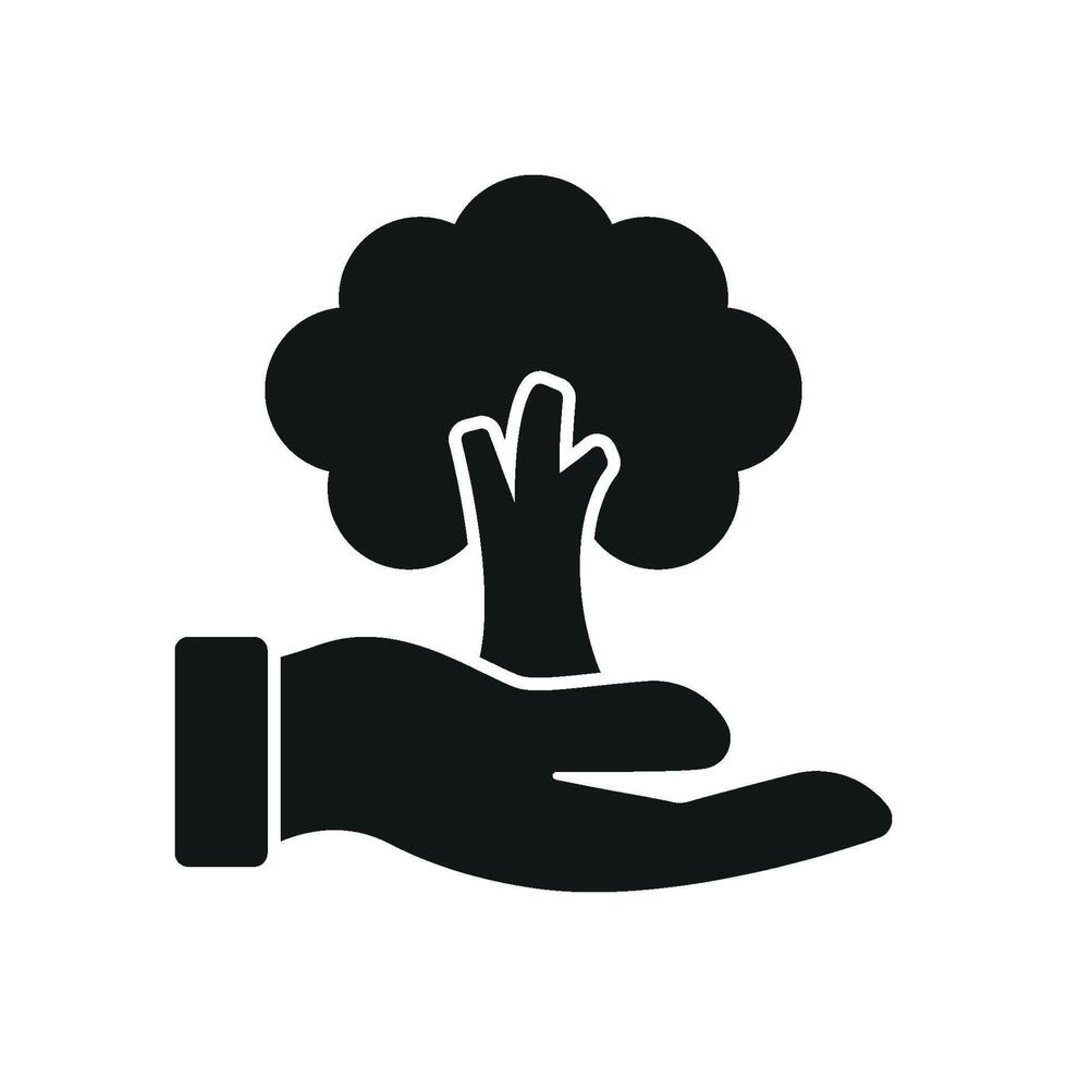 Tree in hand in solid silhouette delivers a bold and meaningful environment care icon. vector
