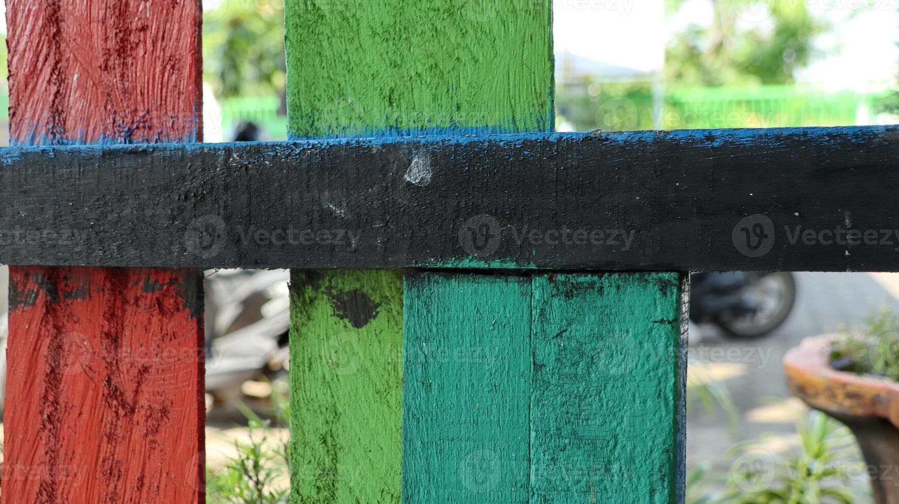 Old multicolored wooden fence. colorful natural background. photo