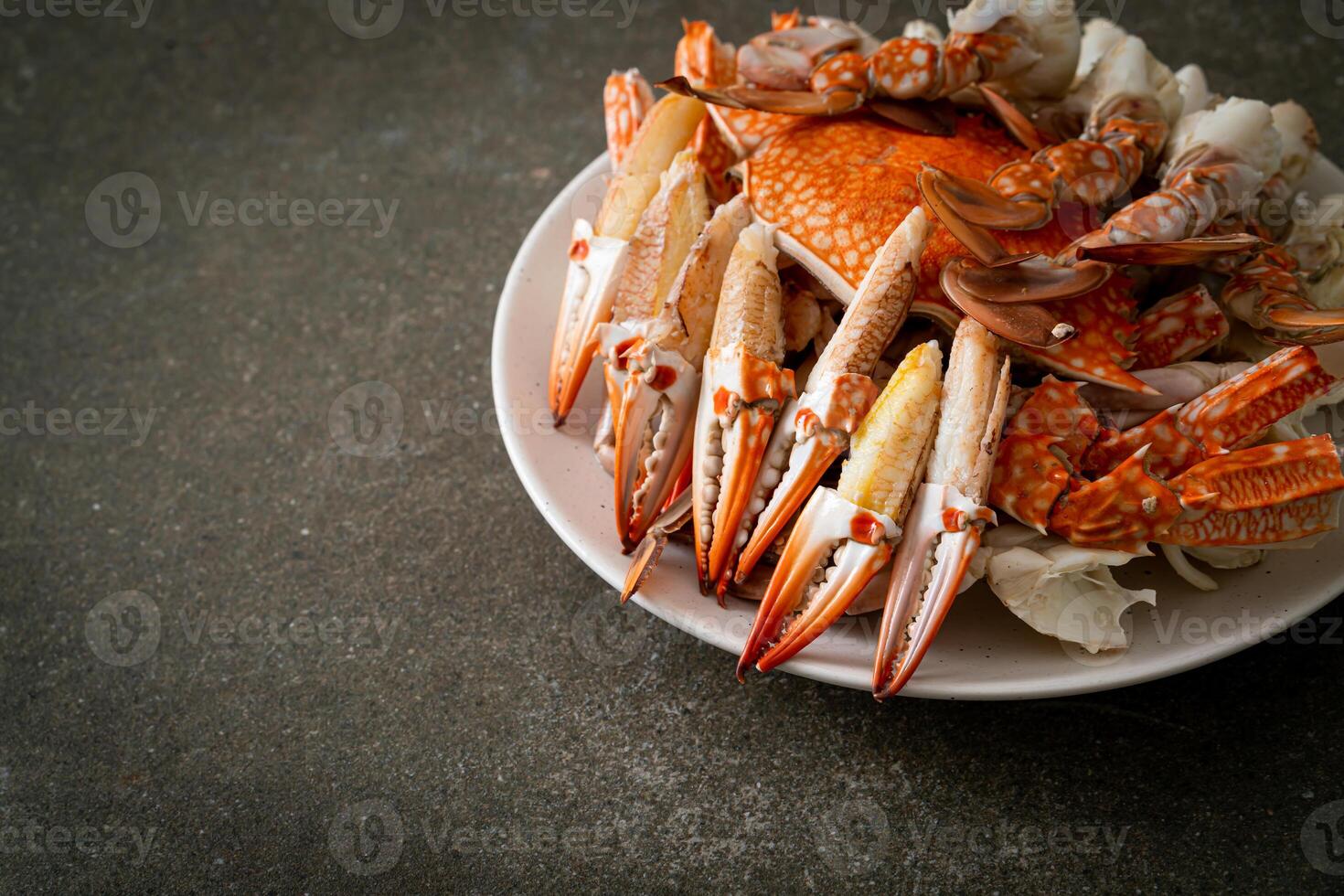 Steamed blue crab with spicy seafood sauce - seafood style. photo
