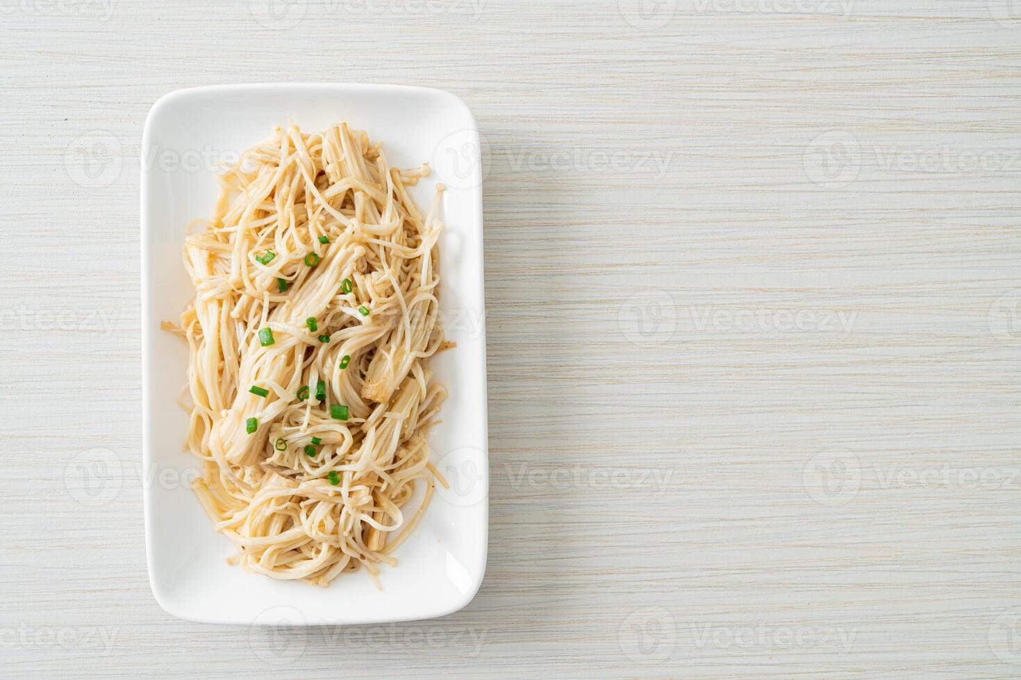 stir-fried golden needle mushroom with butter. photo