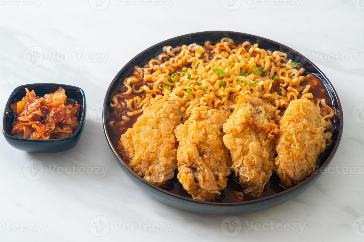 Korean instant noodles with fried chicken or Fried chicken ramyeon. photo