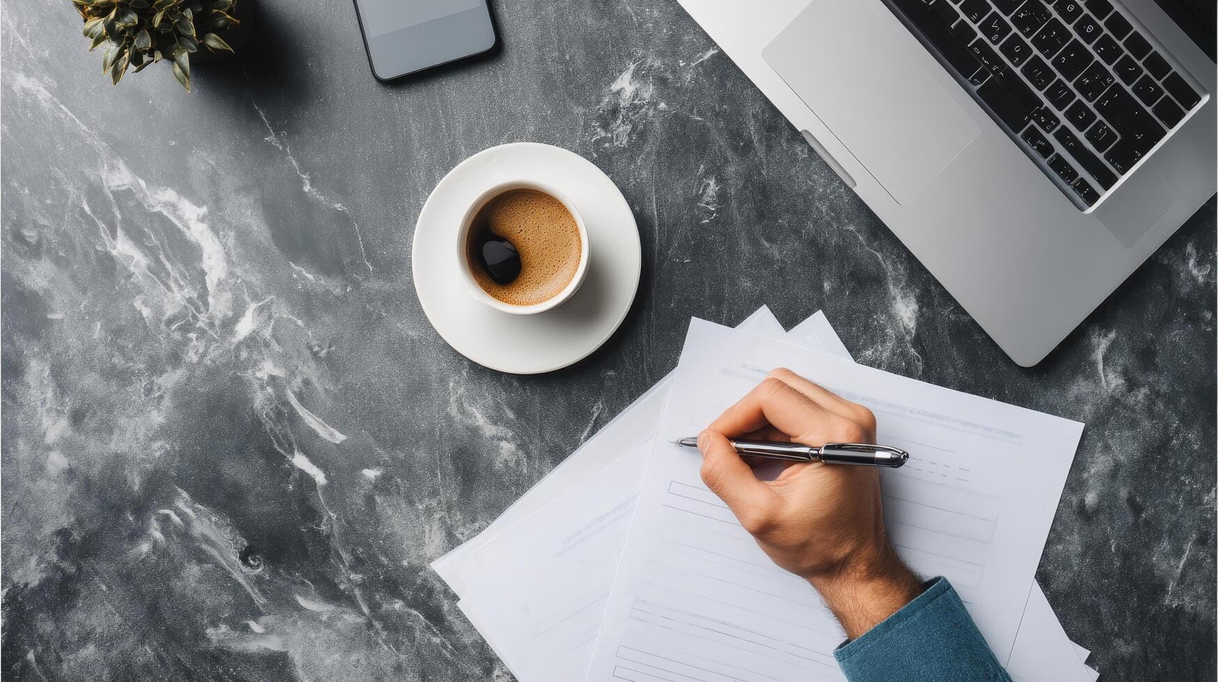 Overhead view of businessman's hand writing on document office professional photo