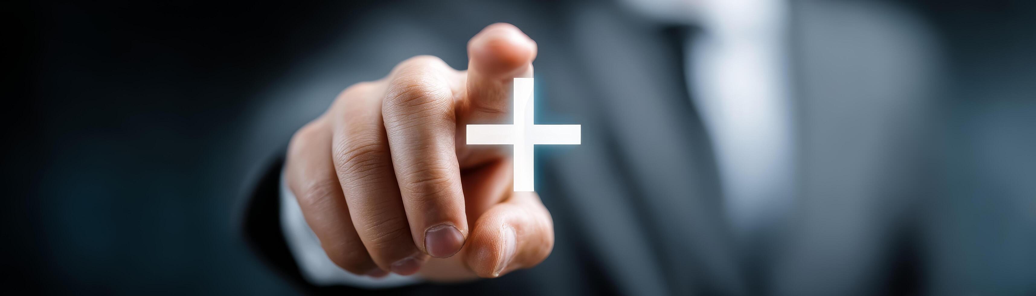 Businessman pointing at plus icon on screen for decision-making photo