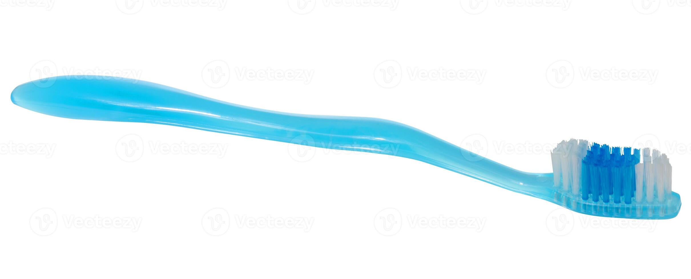 Blue toothbrush with white and blue bristles. Oral hygiene item on isolated background. photo