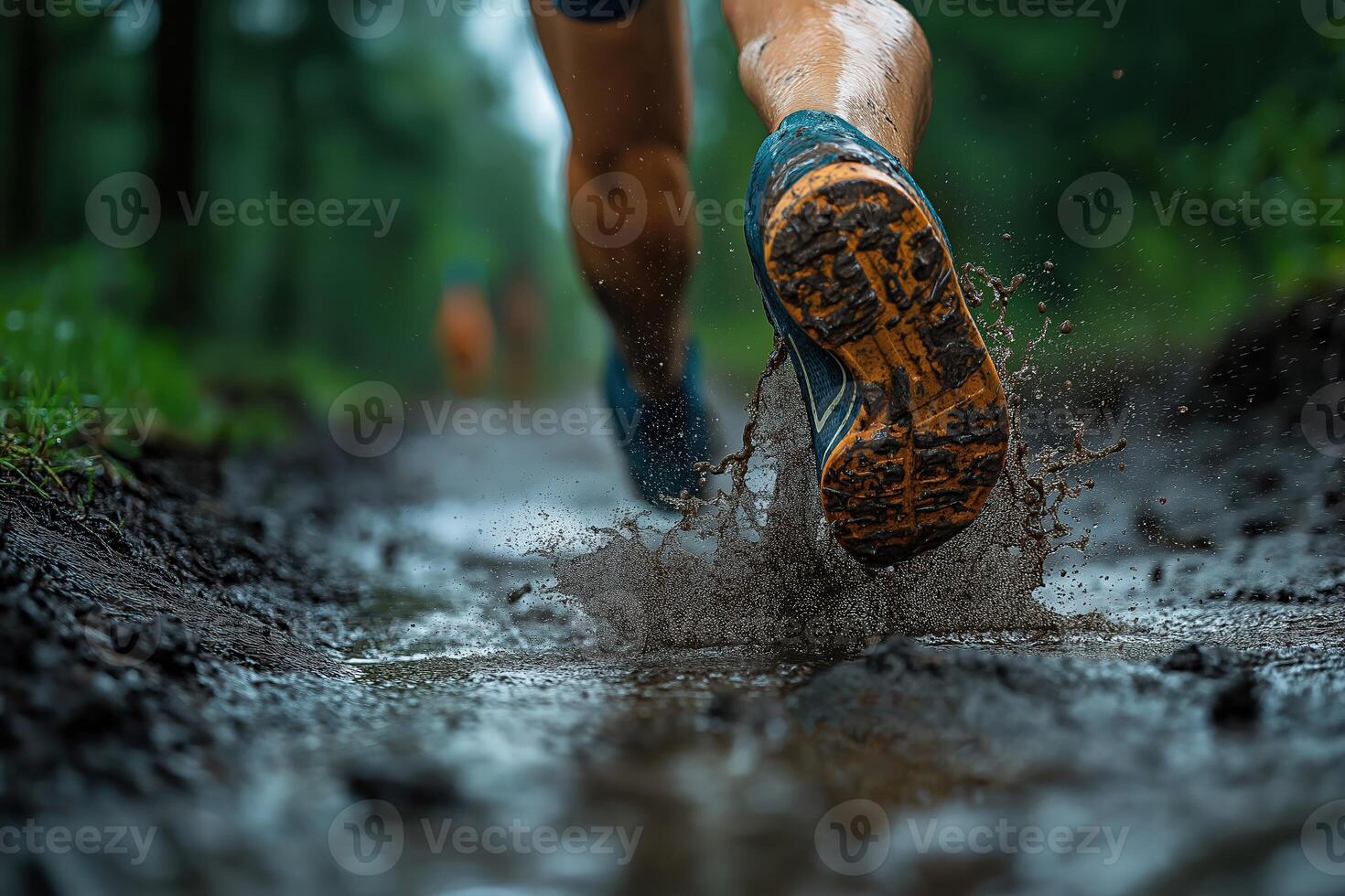 Trail running shoes splashing mud and water on forest path photo