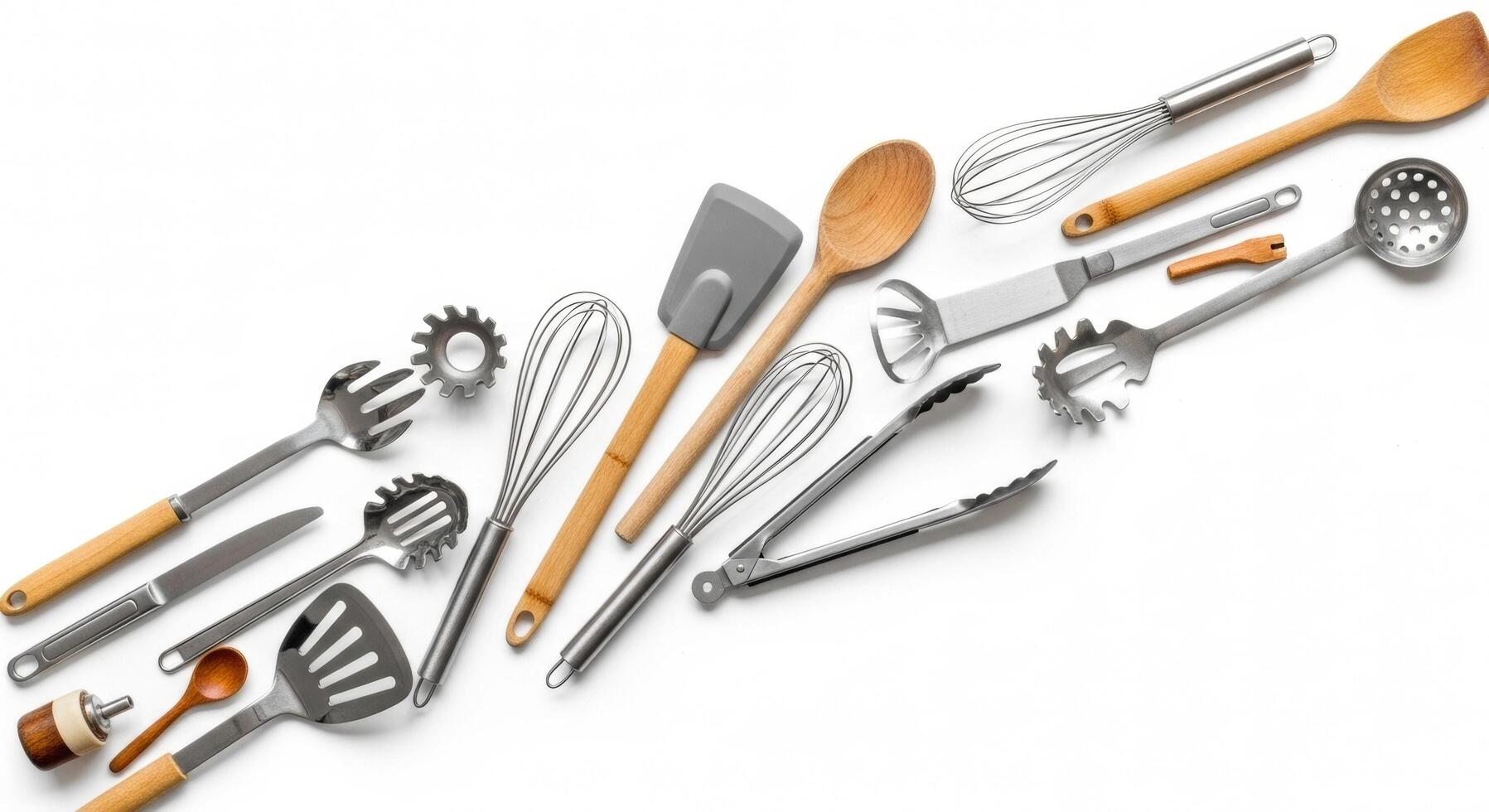 Kitchen Utensils Composition Whisks, Spoons, and Tongs on a White Background photo