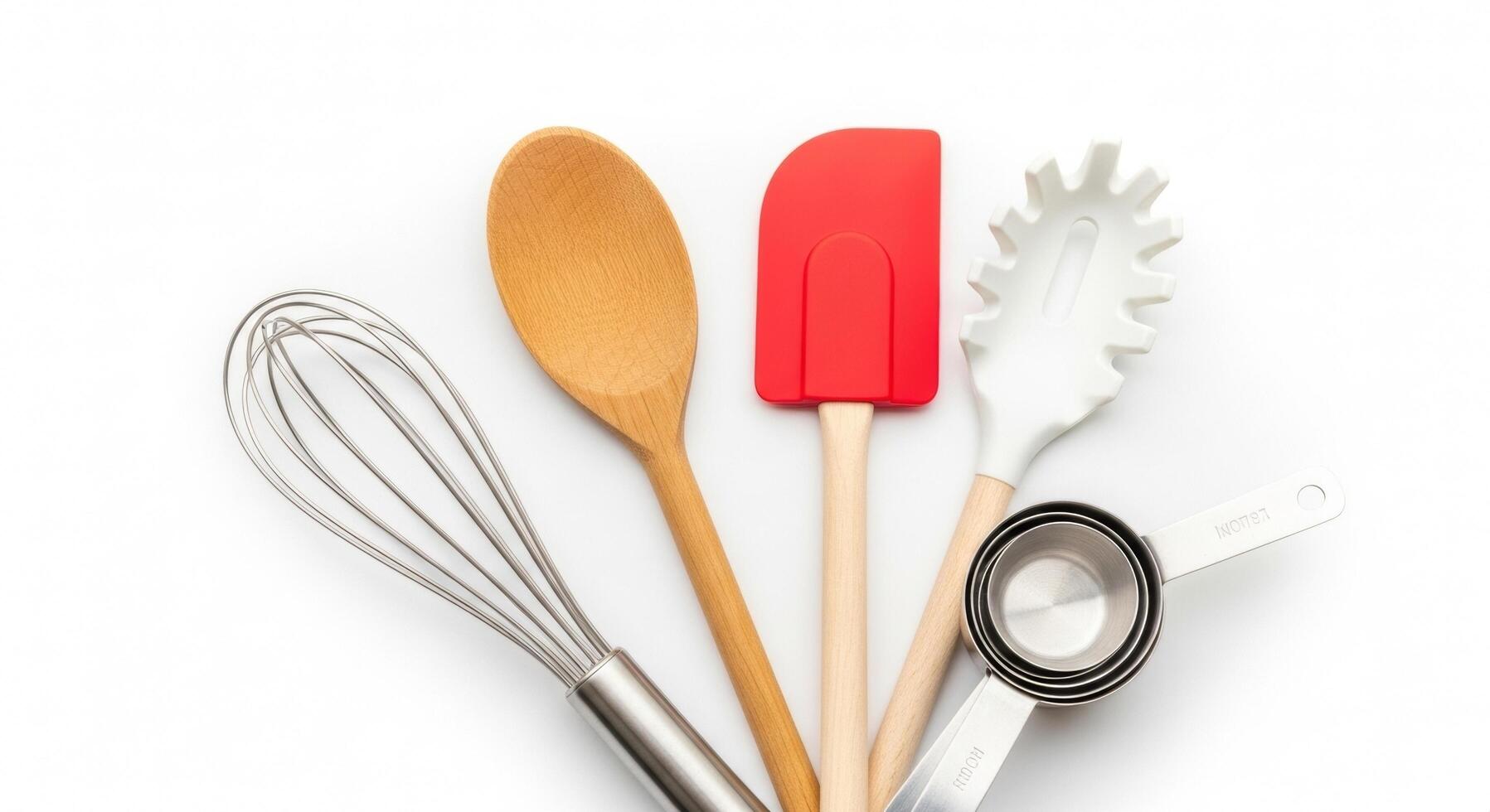 Kitchen Utensils Still Life Whisk, Spoon, Spatula, and Measuring Cups on White photo