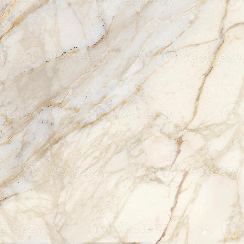 a close up of a marble surface with white and gold paint photo