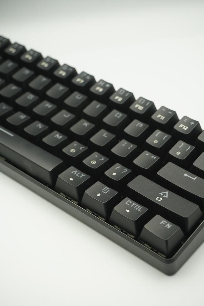 Mechanical keyboard with a 61 layout in black from the top with a white background photo
