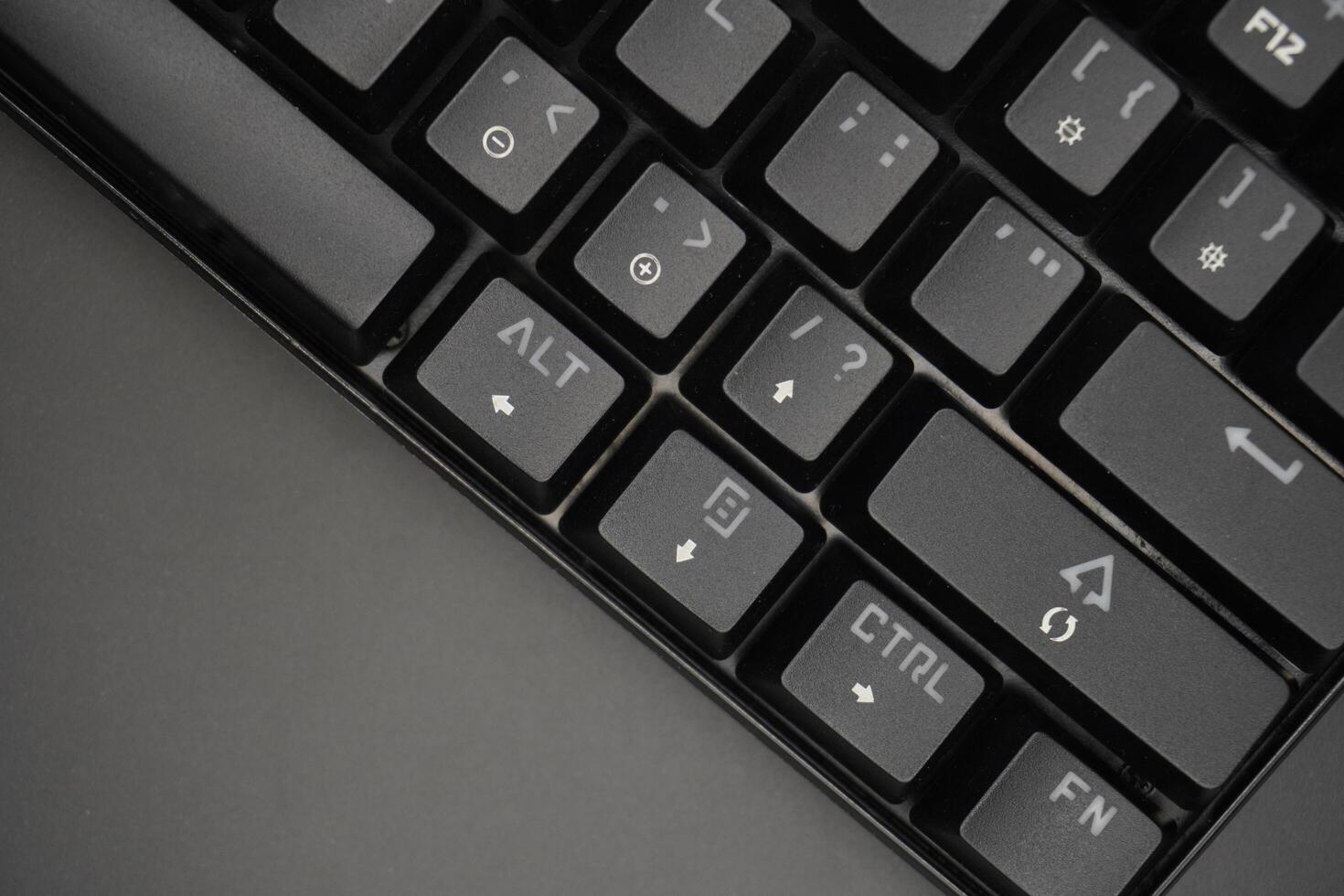 Arrow keys on a black mechanical keyboard with a black background photo