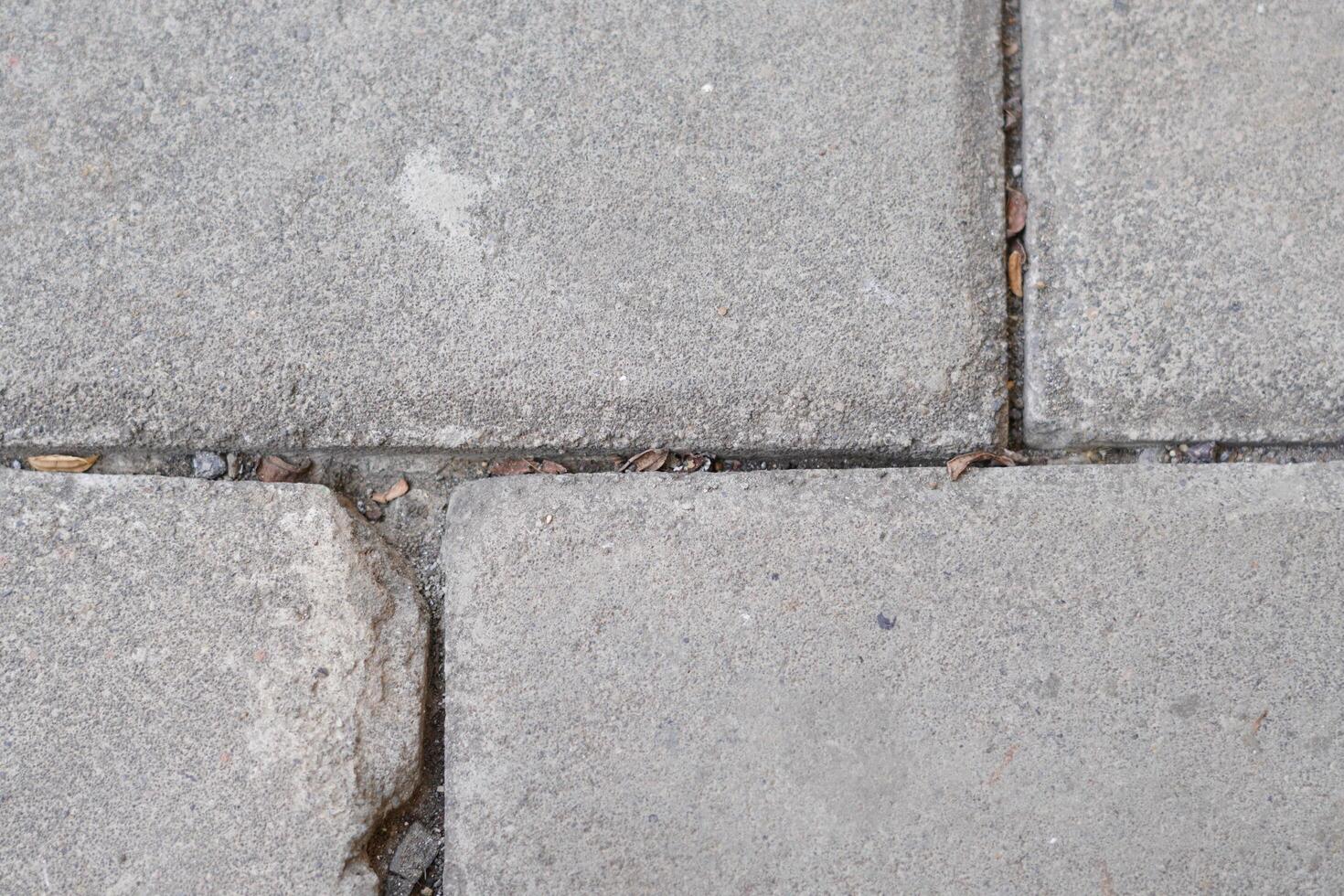 A background of grey paving blocks with lines photo