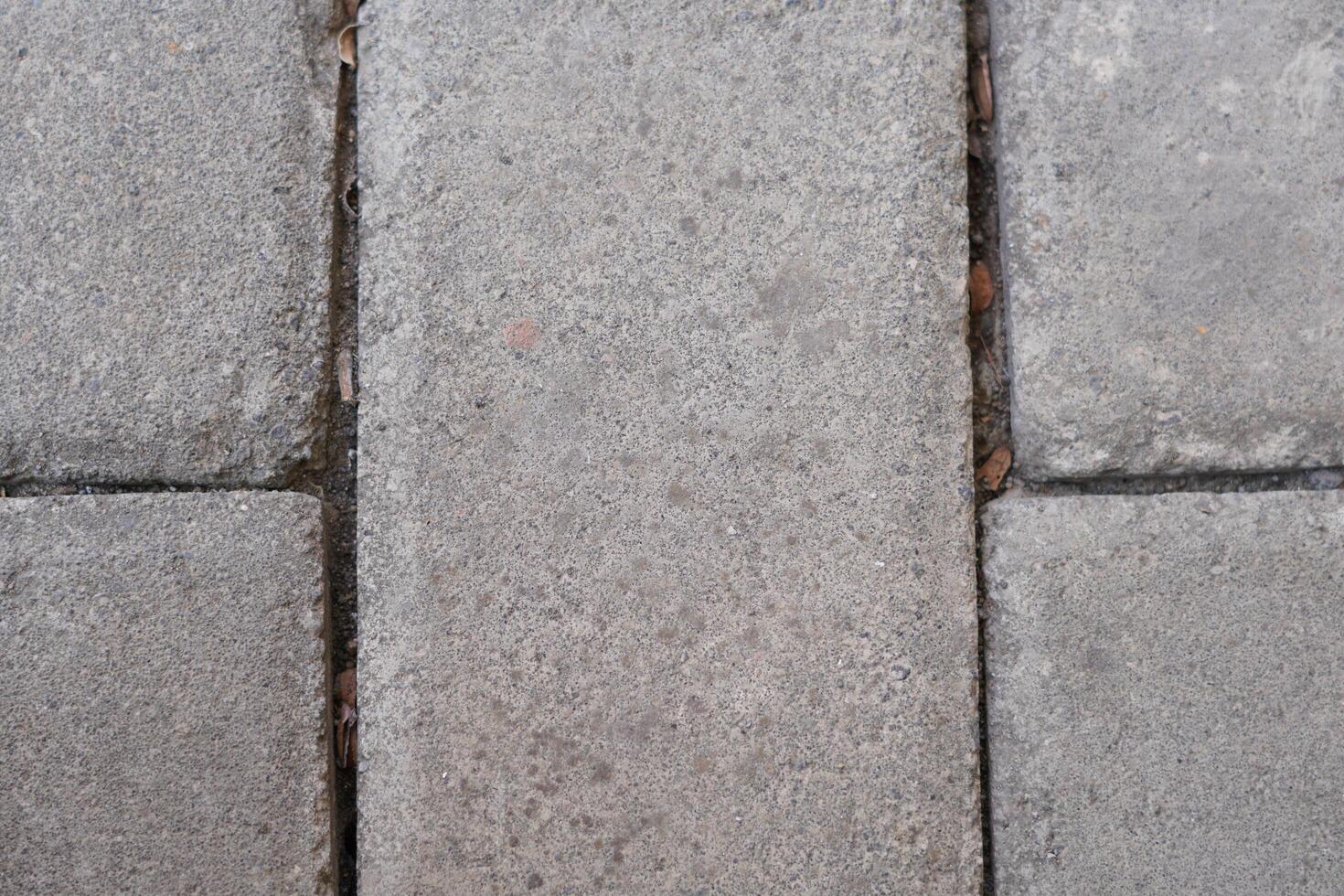 Background of grey paving blocks with lines photo