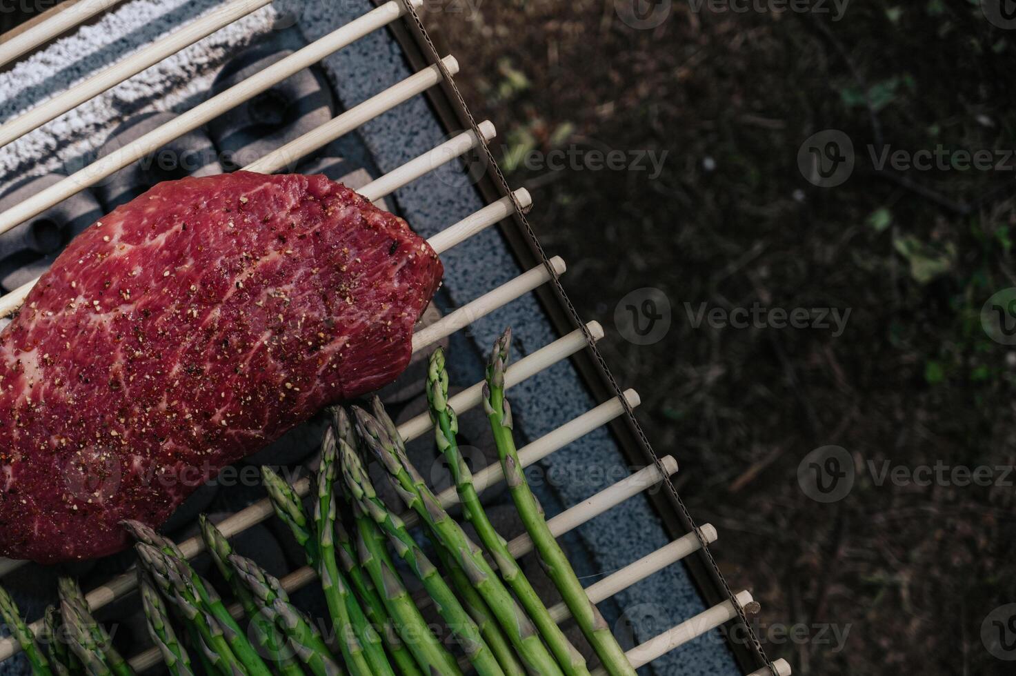 Aparagus and steak on grill. Outdoor picnic in summer.Healthy eating.Copy space banner photo