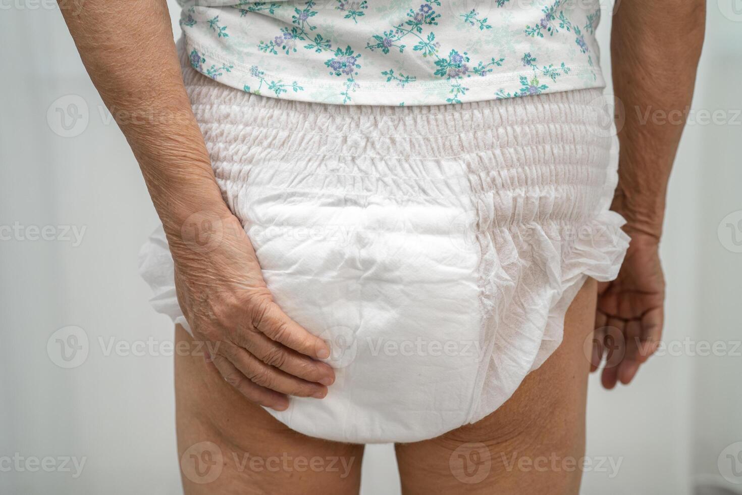 senior woman wearing adult incontinence diaper photo
