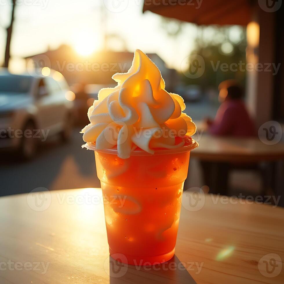 Refreshing Frozen Drink with Cream on Wooden Table at Sunset photo