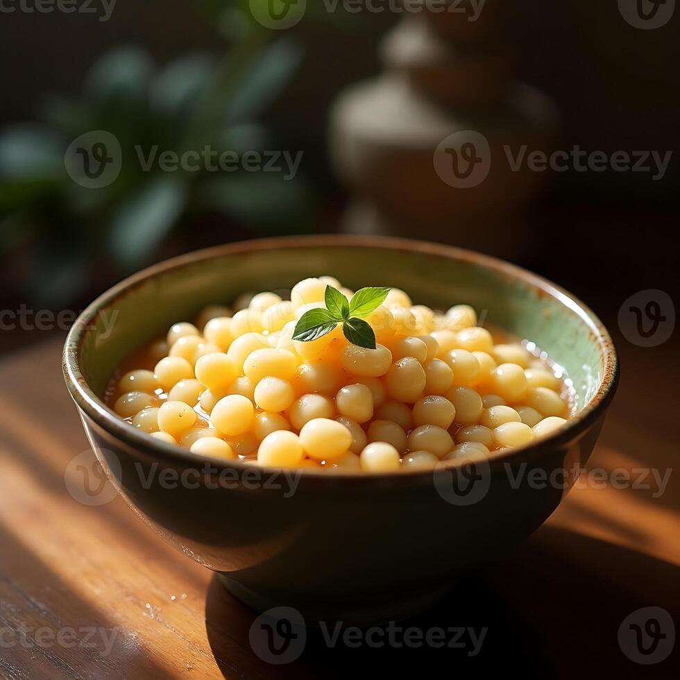 Bowl of Round Dumplings with Fresh Mint Garnish photo