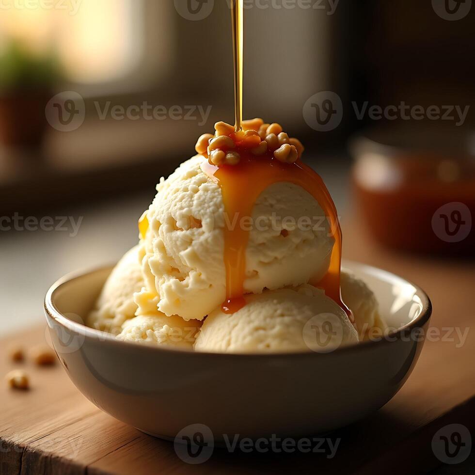 Ice Cream with Caramel Sauce and Nuts Topping Being Poured photo