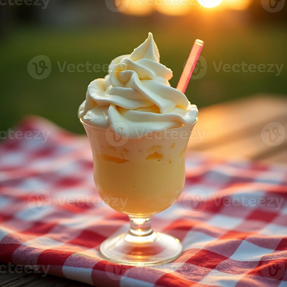 Serving of Frozen Dessert with Swirl Cream on Picnic Table photo
