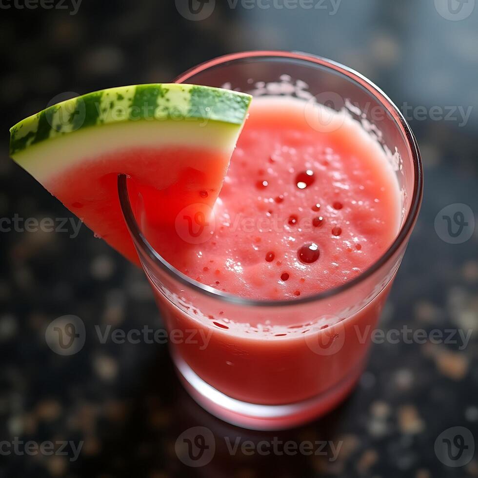 Watermelon Juice in Glass with Fruit Slice Garnishing photo