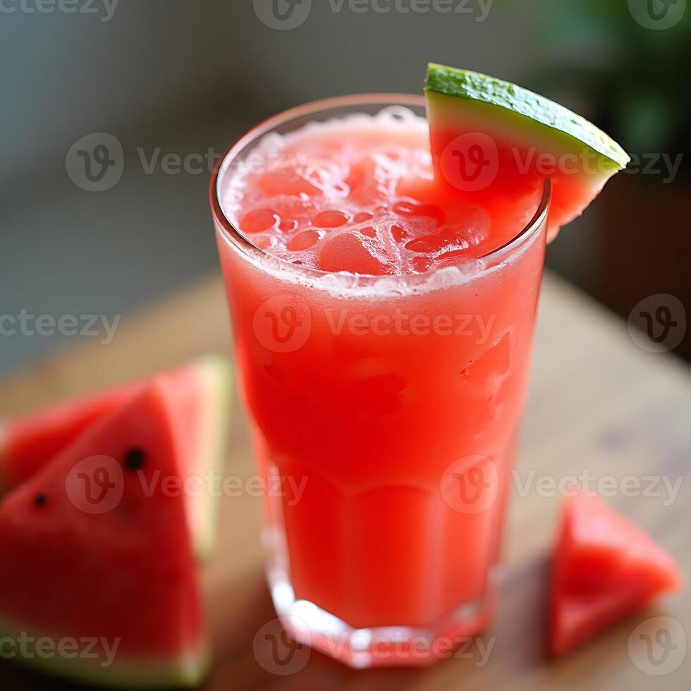 Drinking Fresh Watermelon Juice in Glass with Ice photo