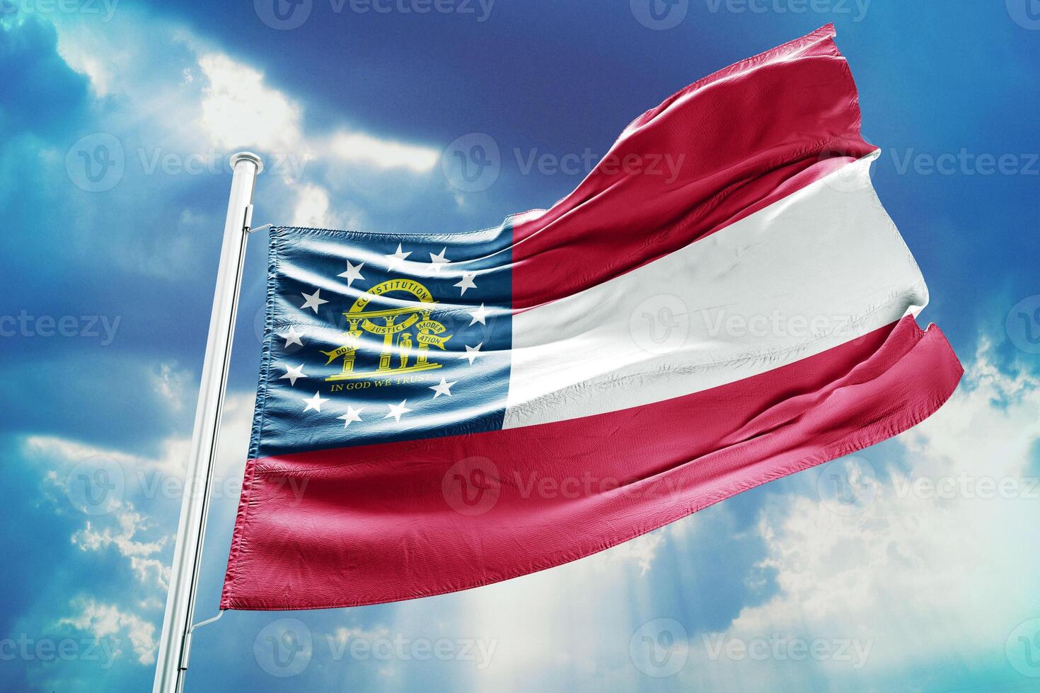 The flag of georgia is flying high in the sky photo
