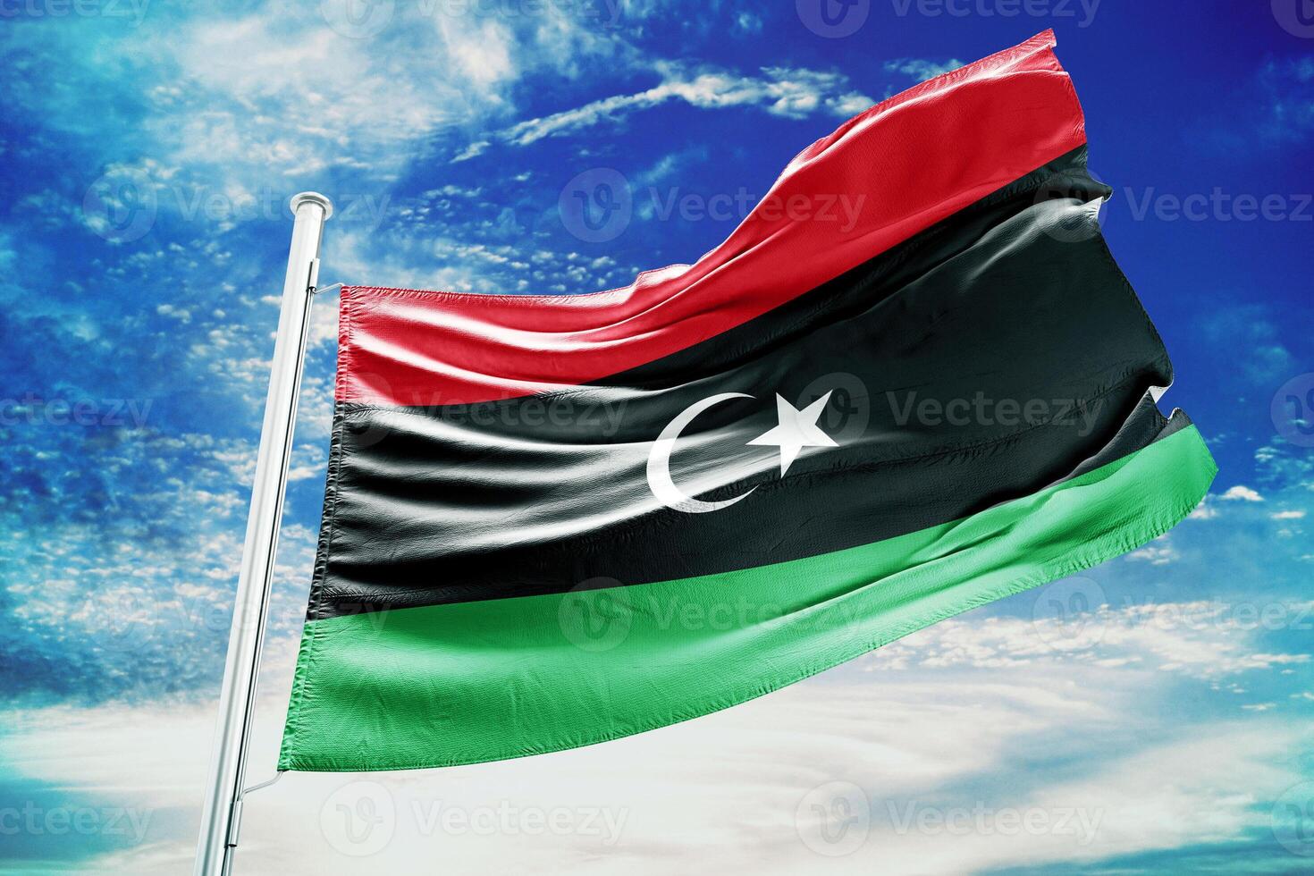 Libya's flag is flying high in the sky photo