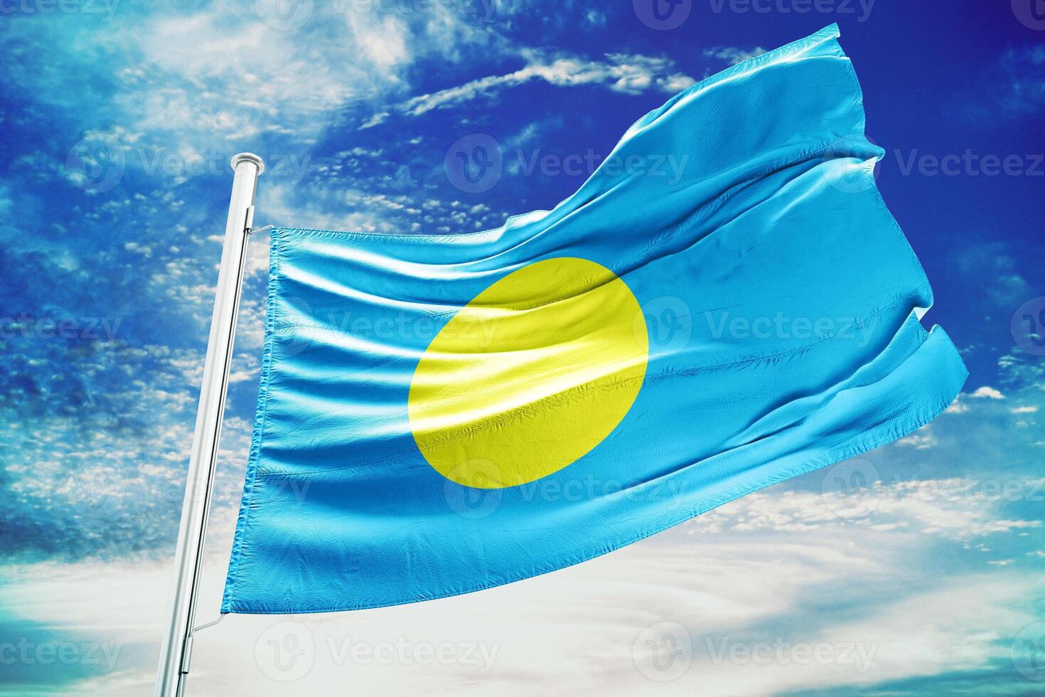 The flag of the country of fiji is flying high in the sky photo