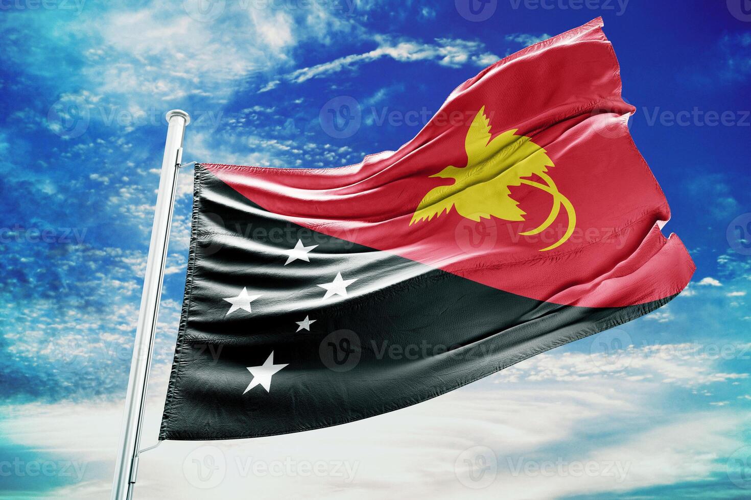The flag of papua is flying high in the sky photo