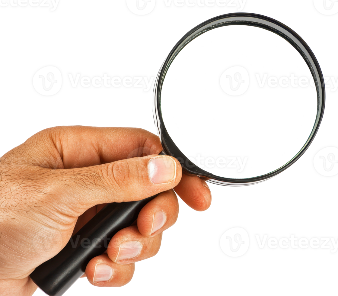Close up of a hand holding a magnifying glass clear glass lens and black handle png