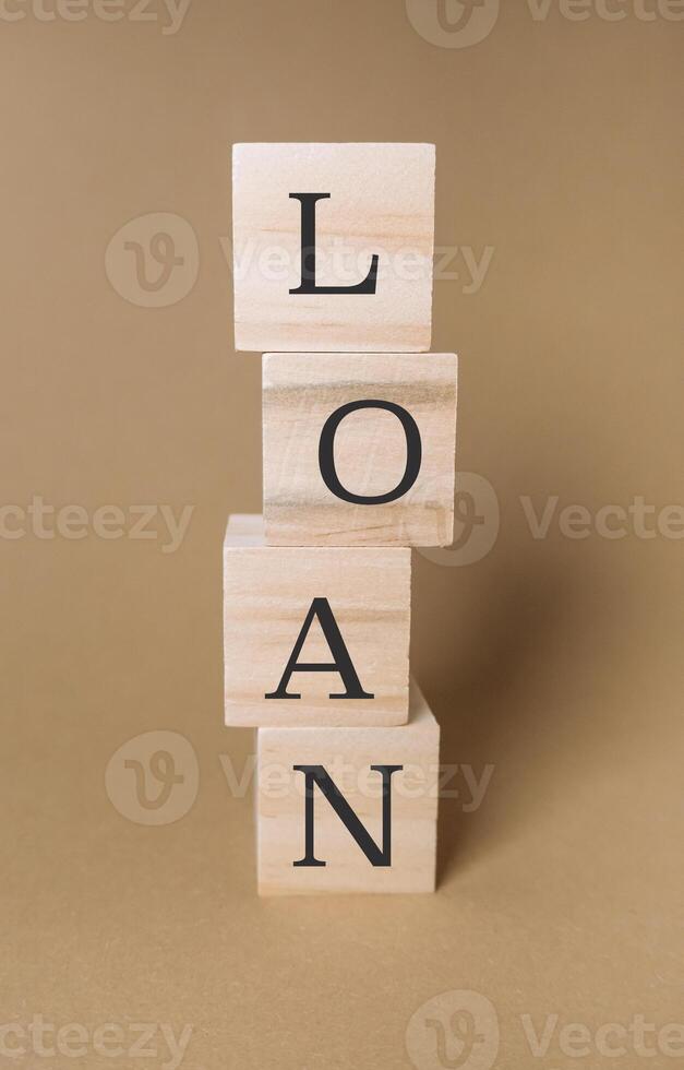 Stack of wooden blocks with the word loan written on them photo