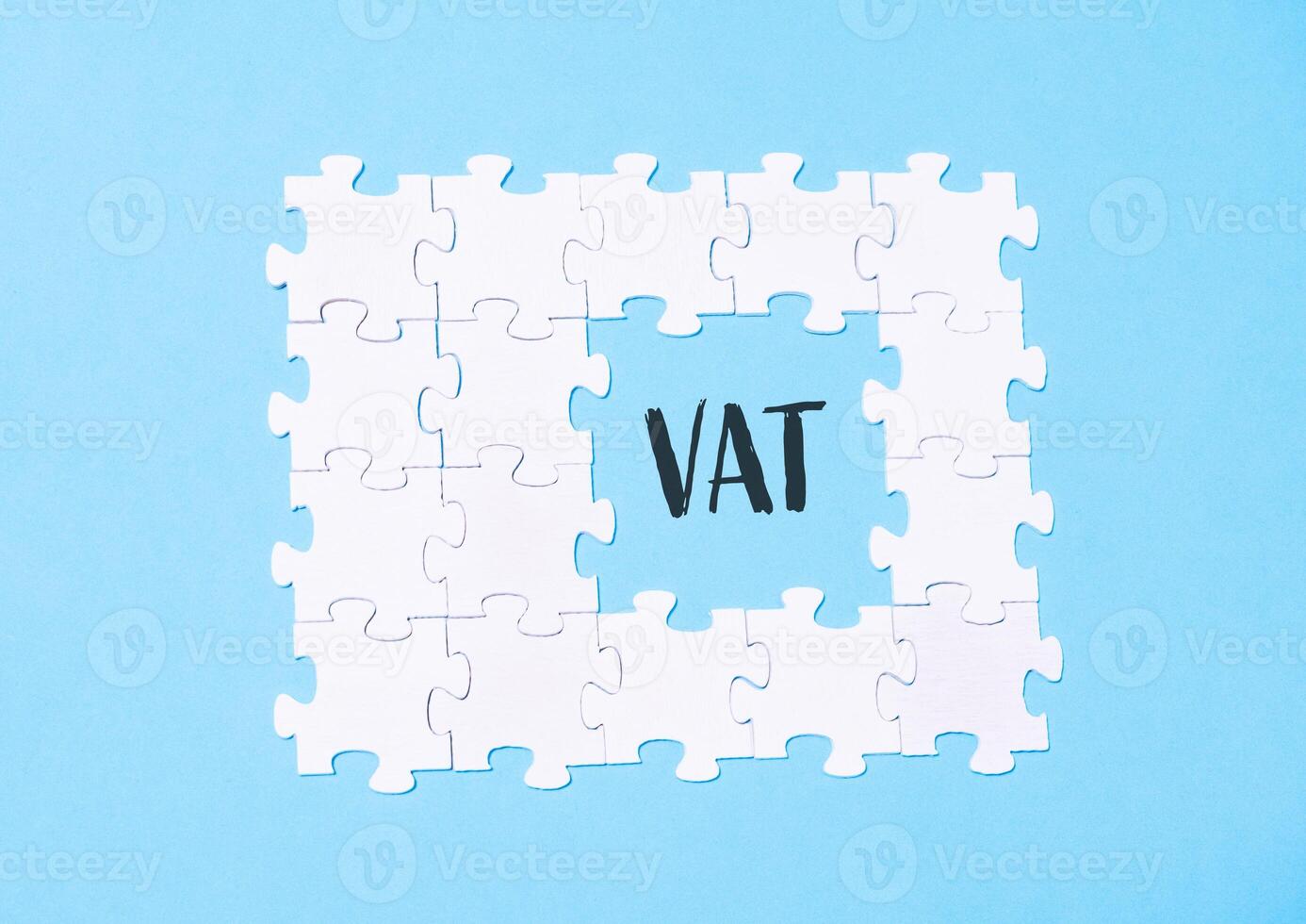 Jigsaw puzzle with the word VAT written in the middle photo