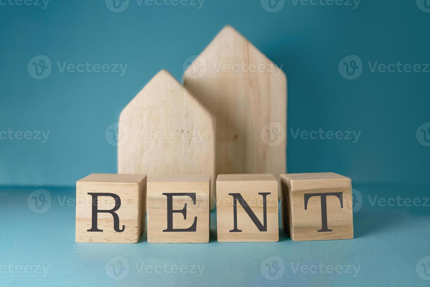 Wooden block with the word rent written on it photo