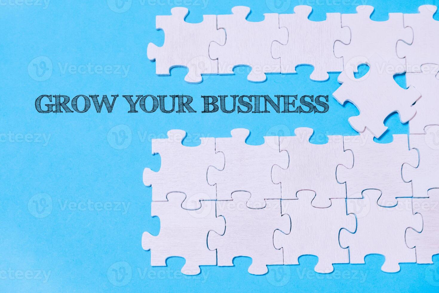 Puzzle with the words grow your business written on it photo
