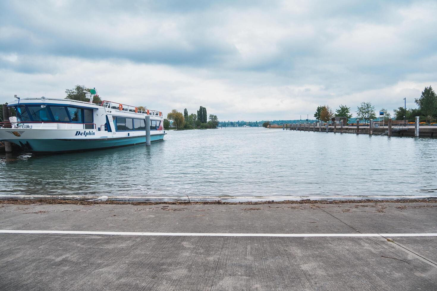 Basel, Switzerland - May 13, 2023 - Boat is docked at the pier photo