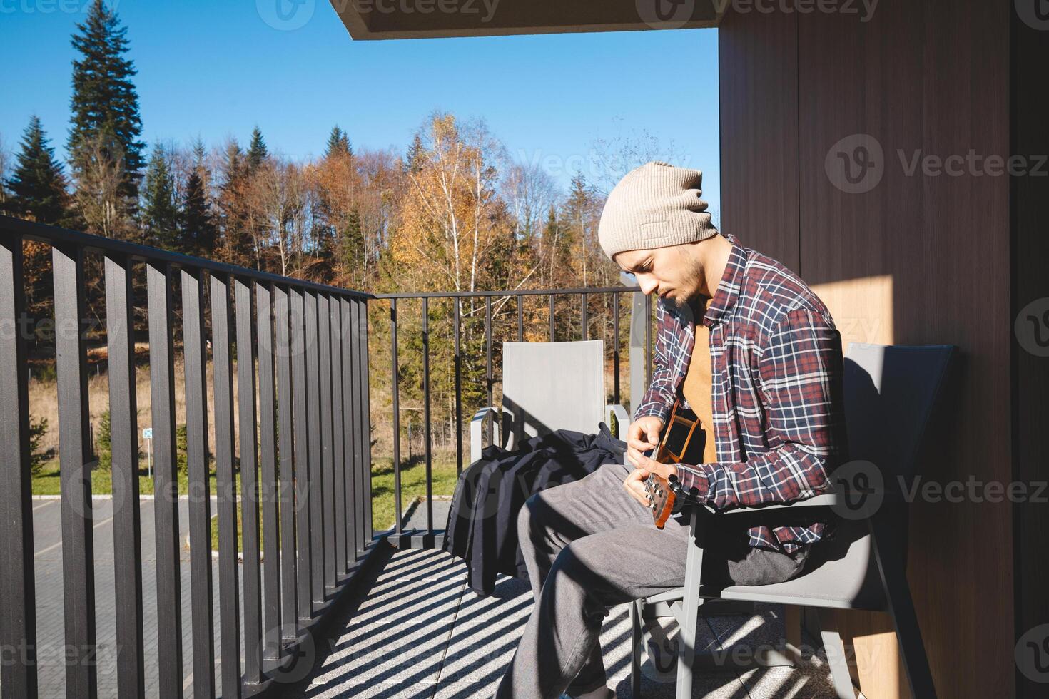 Ukulele sessions made better with forest sights. photo