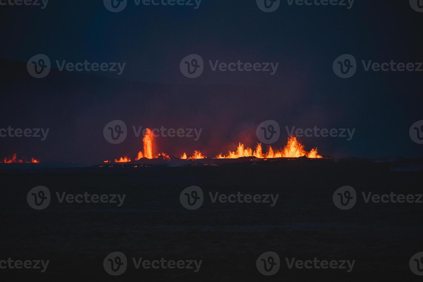 Fagradalsfjall area under volcanic activity. Grindavik Iceland. Bright volcanic eruptions light up the dark Icelandic night, with glowing lava fountains. Massive photo