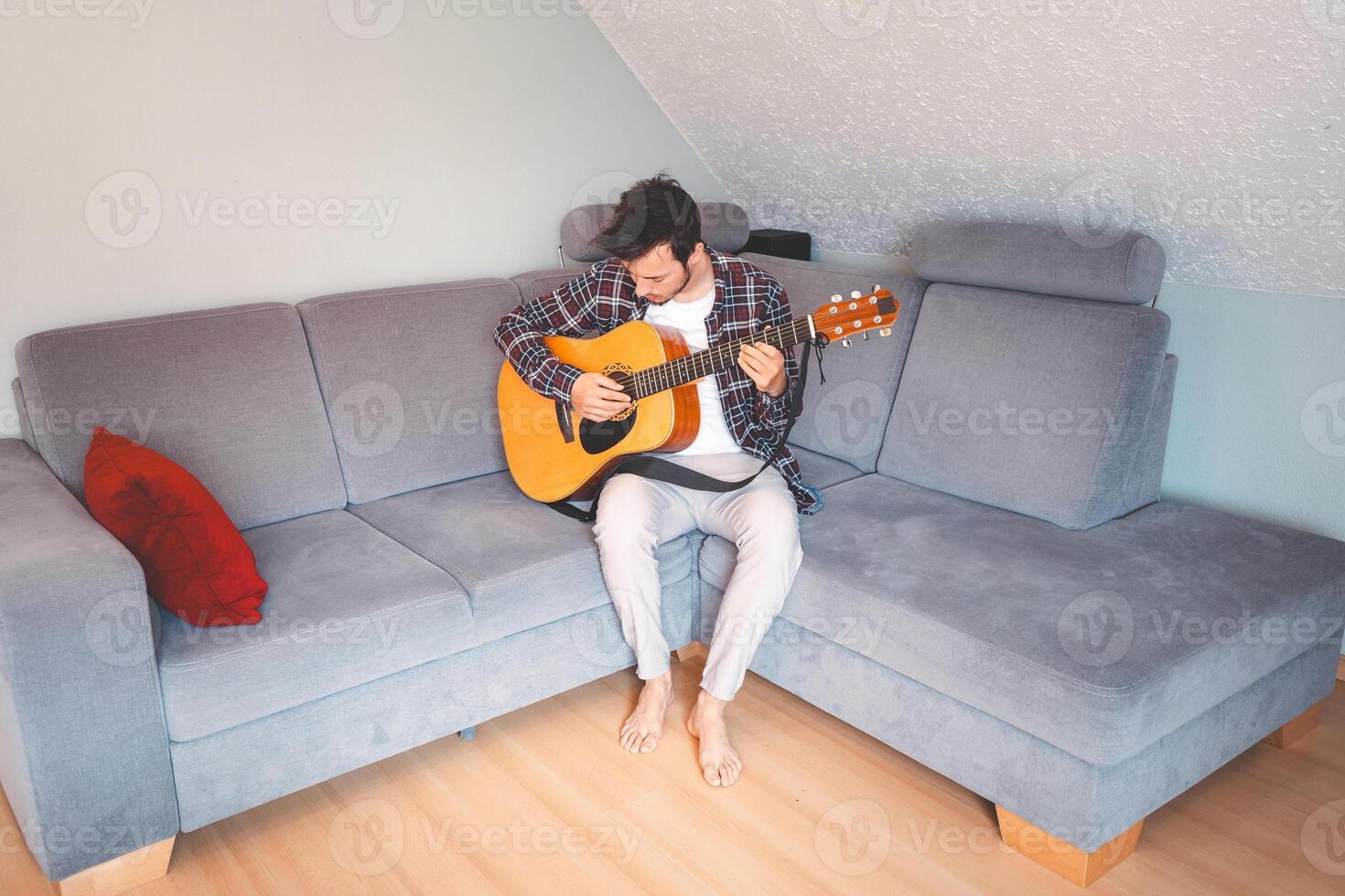 Unwinding with guitar in a warm and simple space photo