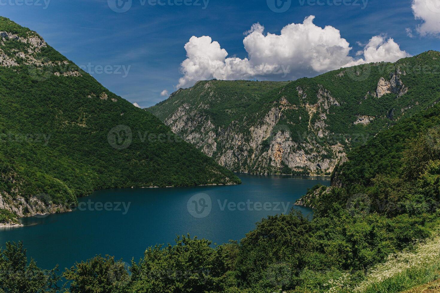 Amazing view of Piva Lake and beautiful mountains on a summer day. Travel destination in Montenegro. photo