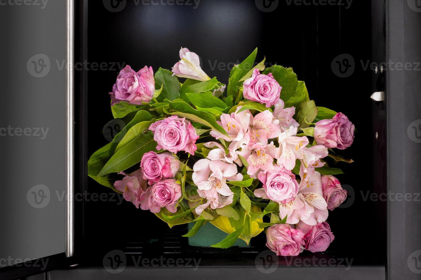 Pink flower bouquet in vending cabinet photo