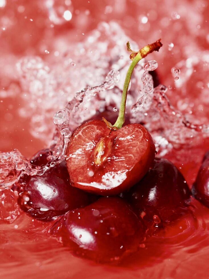 Cherries are being splashed in water photo