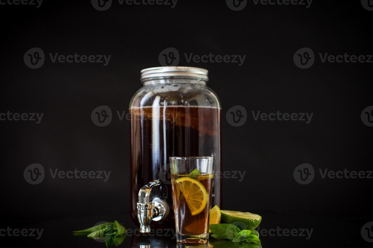Homemade kombucha starter with kombucha on a black background photo